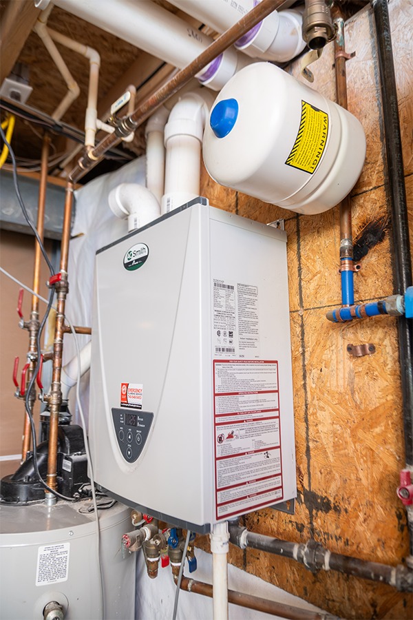 A high-efficiency water heater and expansion tank installed by Emergency Plumbing Heating &amp; Air. 