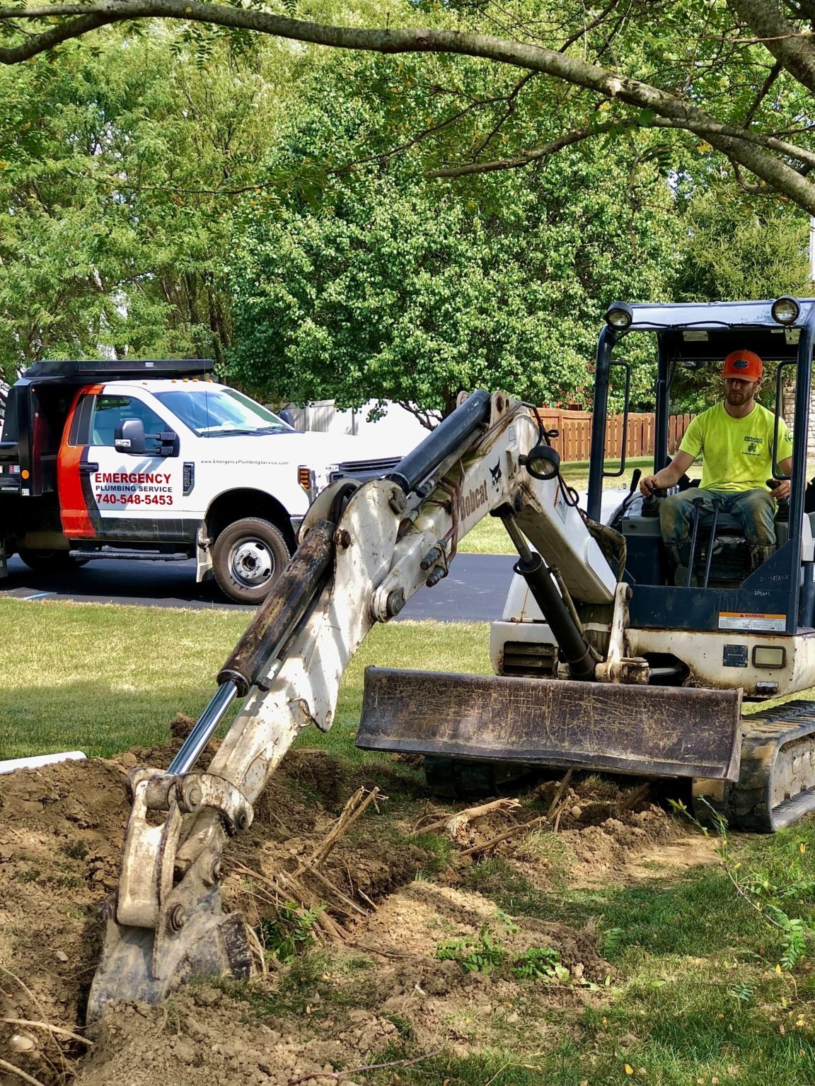 Emergency plumbing company excavates a trench. 