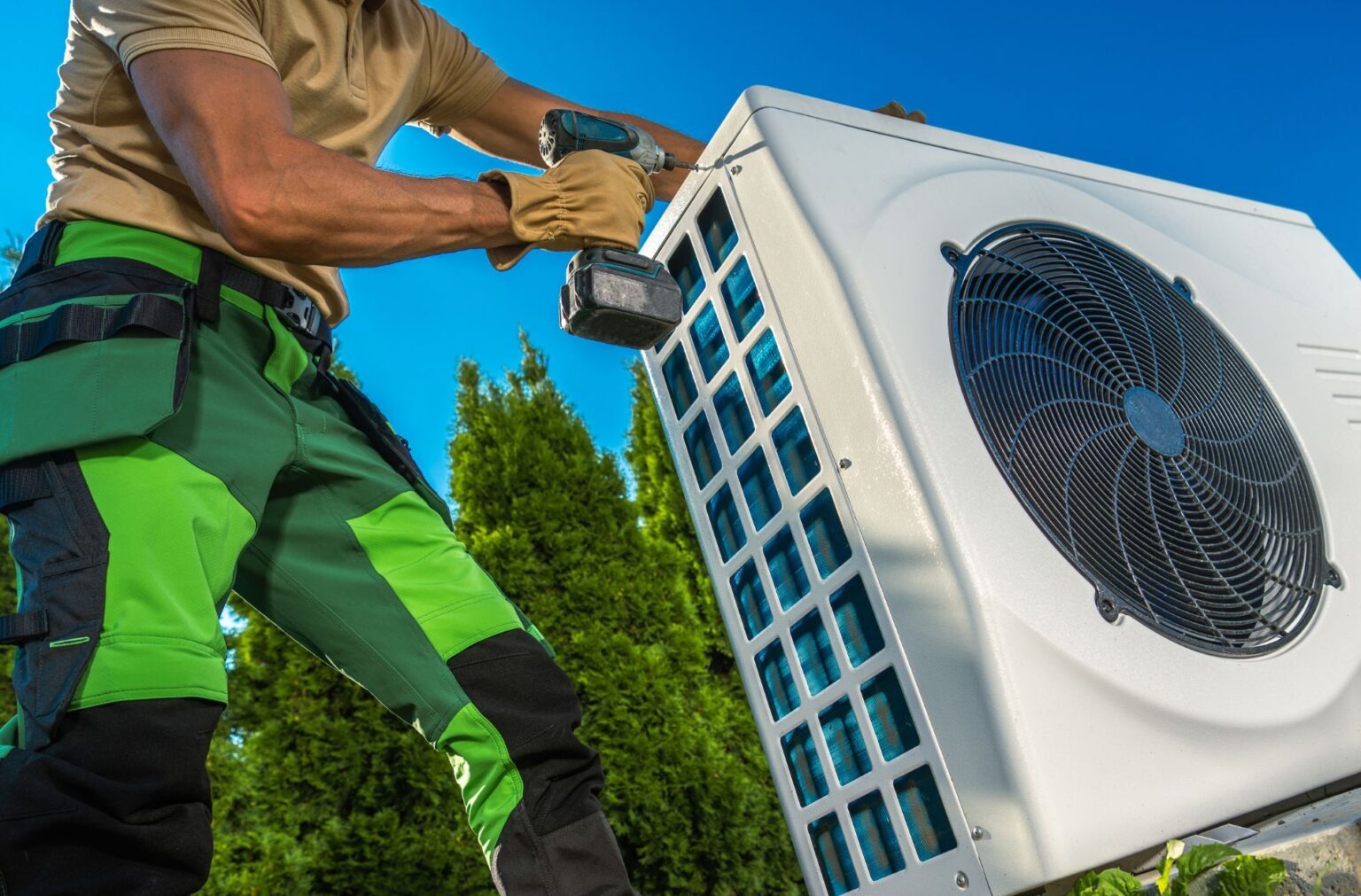 A technician installs an air conditioning unit, ensuring optimal home and business comfort.