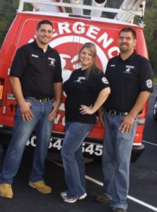 The Emergency Drain and Plumbing team stands together in front of their company van